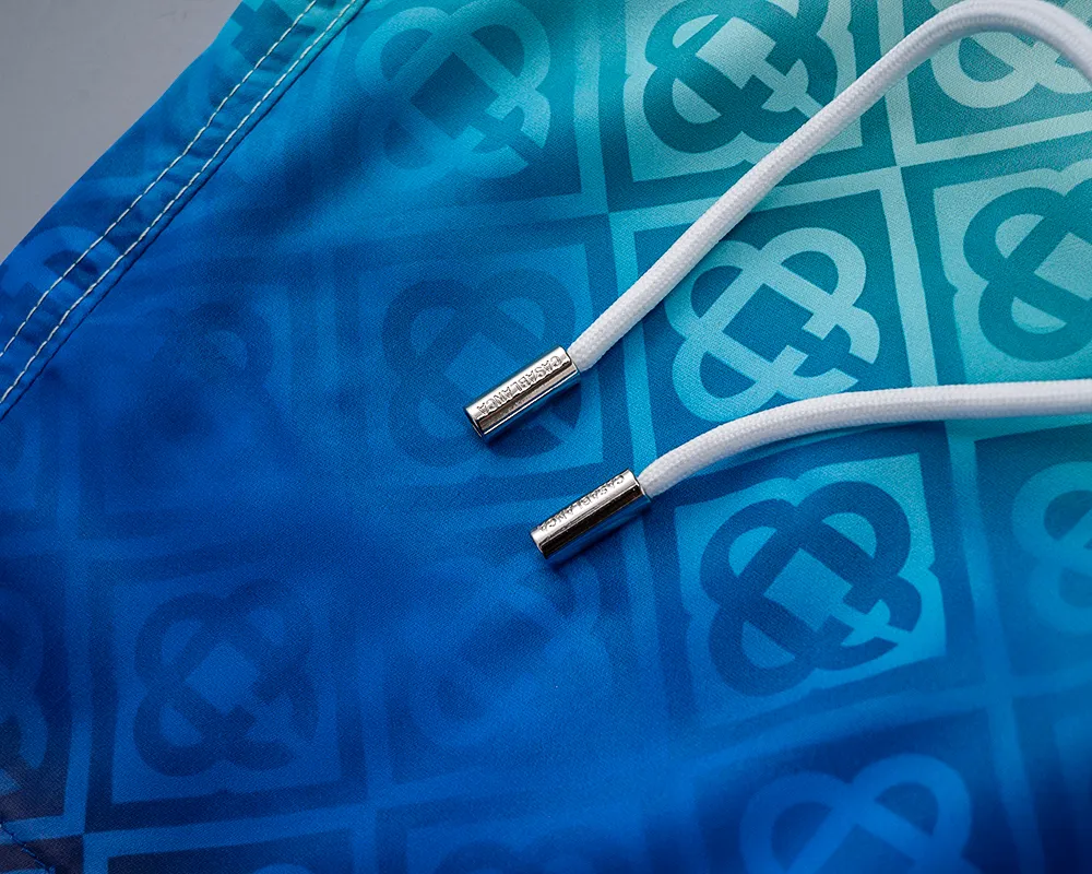 28138# 2026 Spring and Summer New Arrival Men's Short High Quality Swimming Beach Shorts. Official website synchronization. Original hardware. Rigorous workmanship. Side seams. Front and rear rails are double-line pressed. M-3XL. Gradual Color Change.
